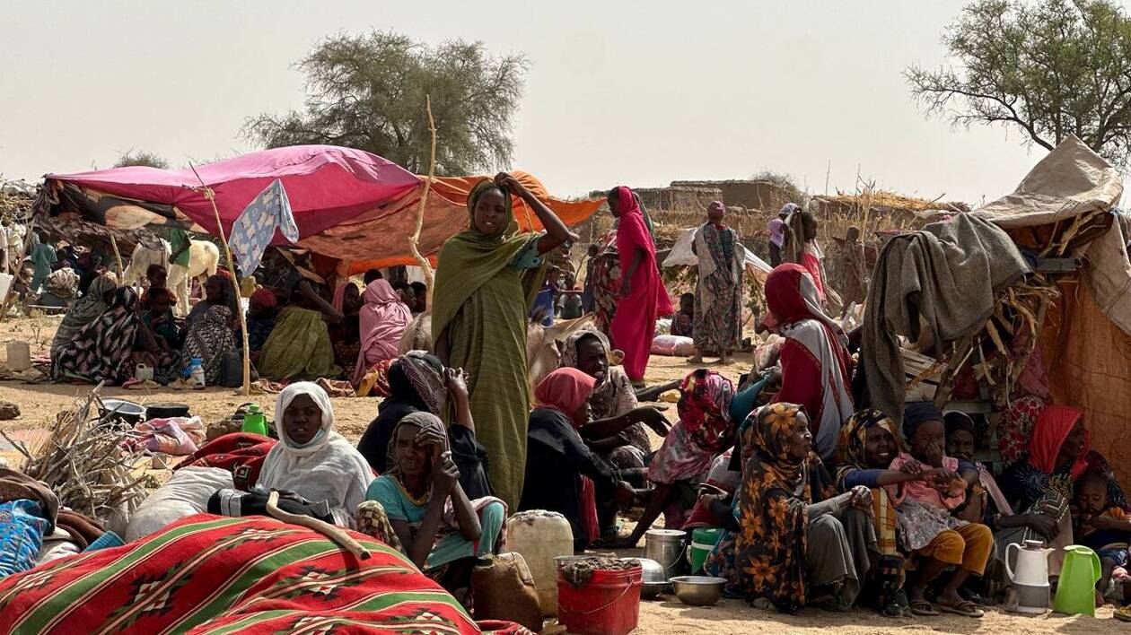 People who fled the Zamzam camp for the internally displaced after it fell under RSF control, rest in a makeshift encampment in an open field near the town of Tawila in war-torn Sudan's western Darfur region on April 13, 2025. Sudan's paramilitary Rapid Support Forces (RSF) announced on April 13 that it had taken control of the famine-hit Zamzam camp, home to over 500,000 refugees according to the United Nations, after two days of heavy shelling and gunfire, amid its ongoing war with the country's army and affiliated forces. (Photo by AFP)